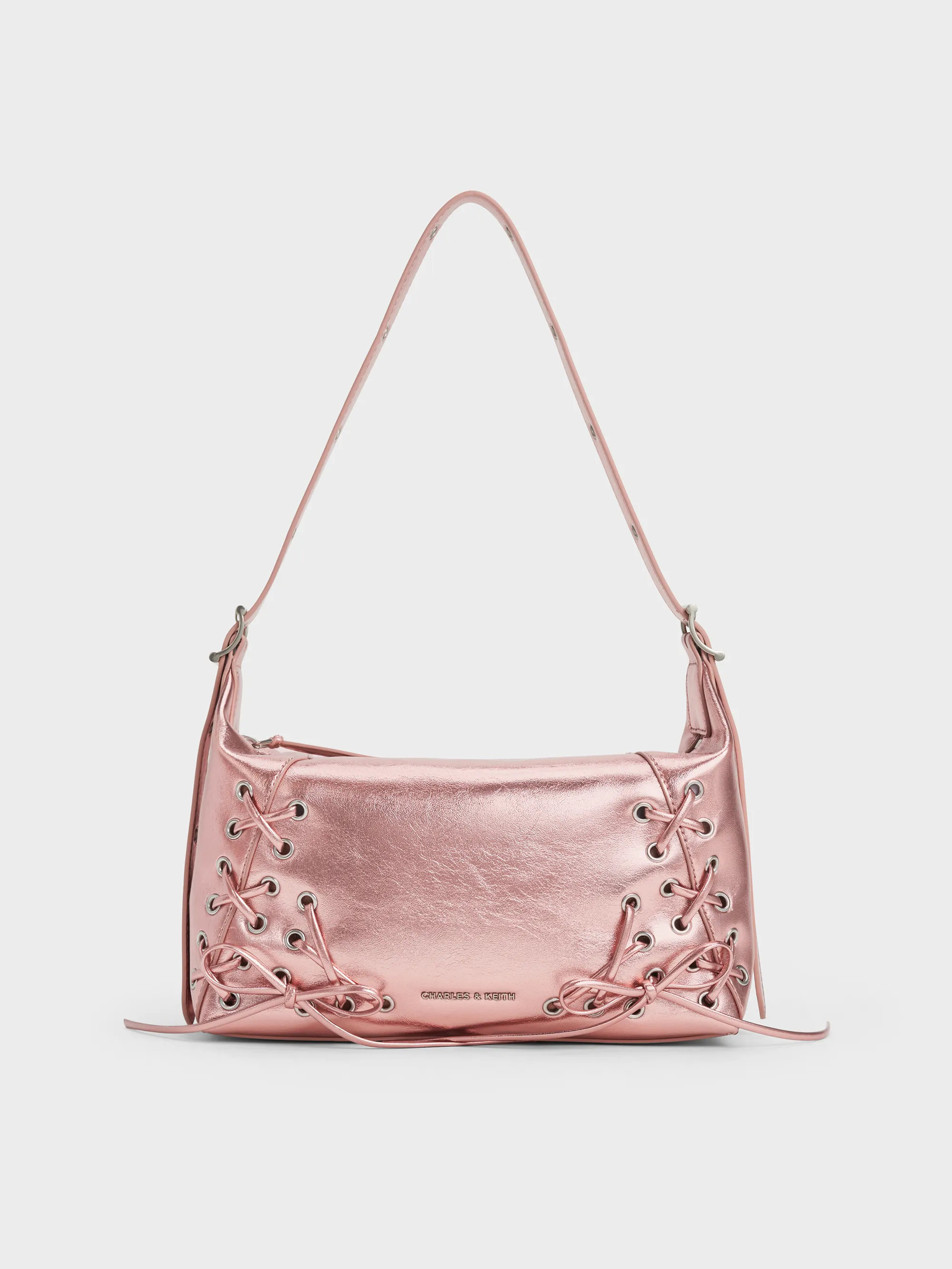 CHARLES & KEITH - Xylia Metallic Grommet Lace-Up Shoulder Bag sold by Charles & Keith