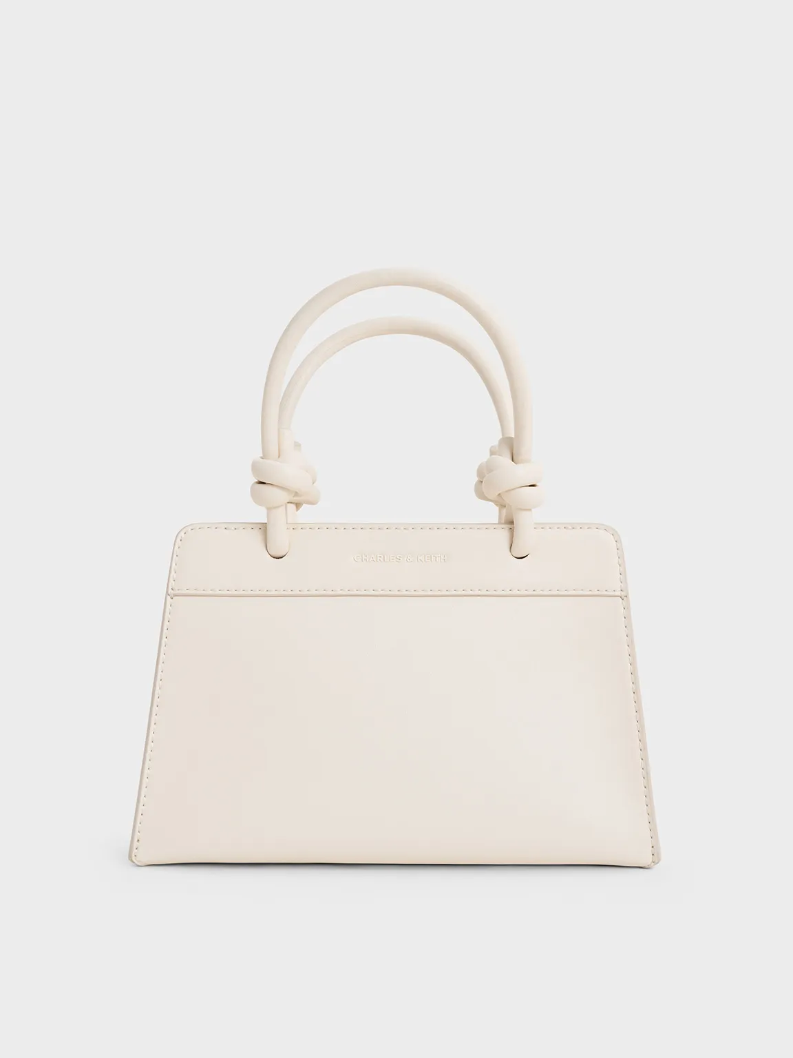 Charles & Keith - Sabine Knotted-Handle Trapeze Tote Bag sold by Charles & Keith