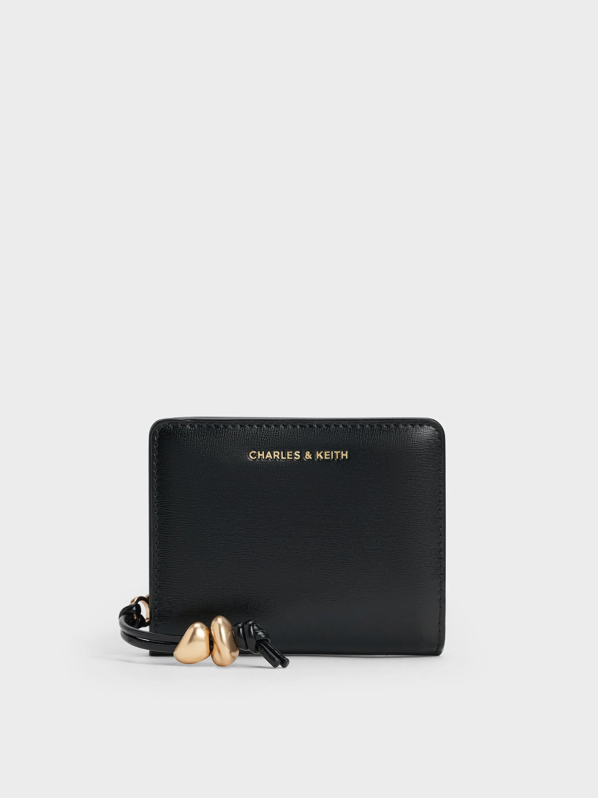 Charles & Keith - Augustine Sculptural-Detail Small Wallet sold by Charles & Keith