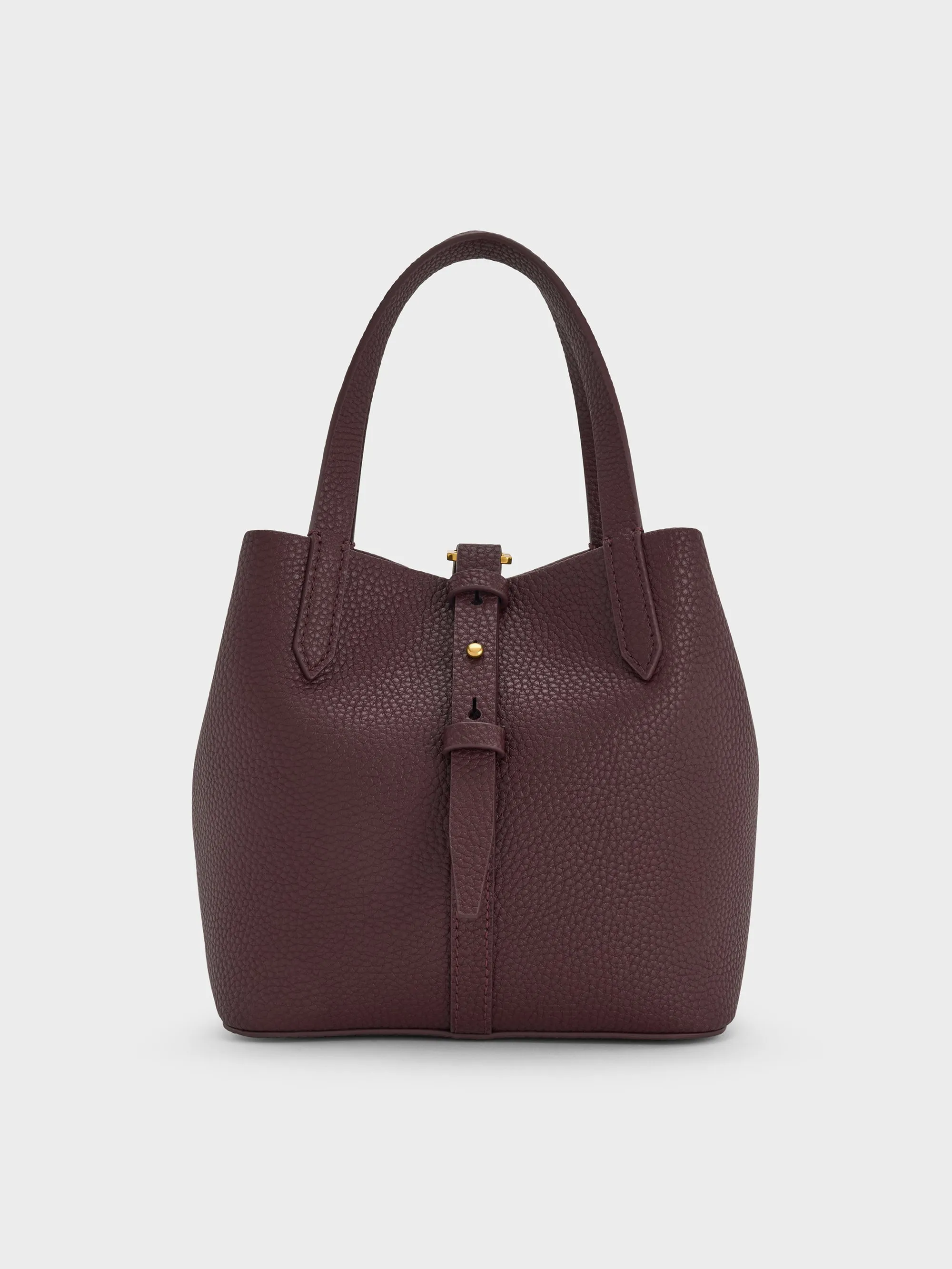 Charles & Keith - Beryl Recycled Leather Double-Handle Belted Bucket Bag sold by Charles & Keith