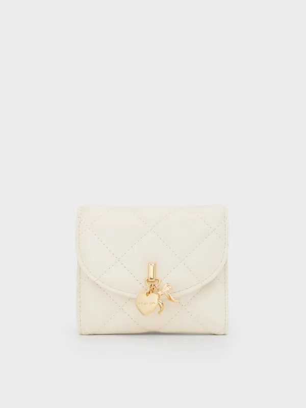 Charles & Keith - Arrietty Quilted Bow-Heart Charm Curved-Flap Wallet sold by Charles & Keith