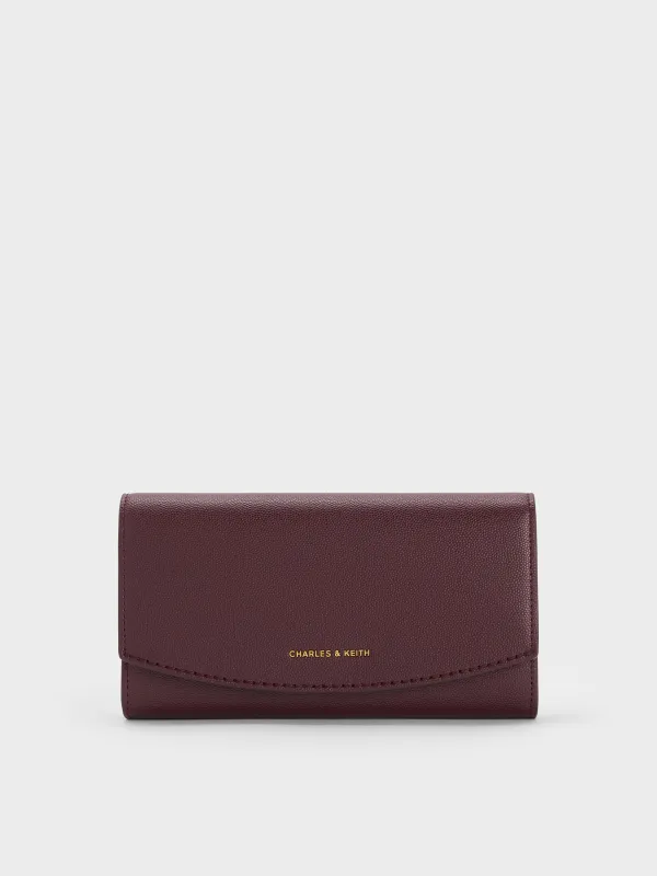 Charles & Keith - Briony Curved Flap Long Wallet sold by Charles & Keith