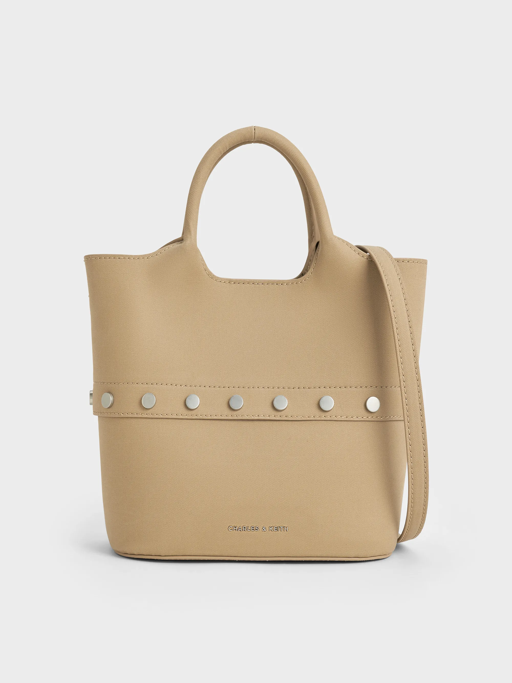 Charles & Keith - Bobbie Twill Studded Convertible Two-Way Bucket Bag sold by Charles & Keith