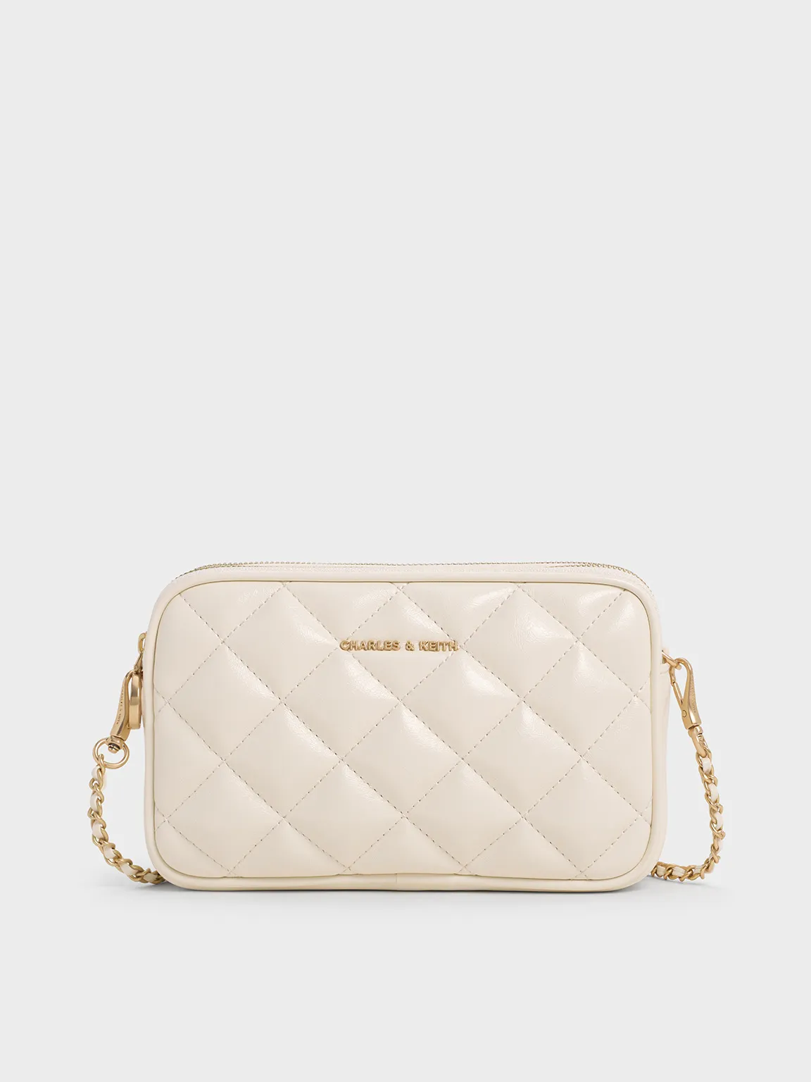 Charles & Keith - Mini Apfra Quilted Crossbody Bag sold by Charles & Keith