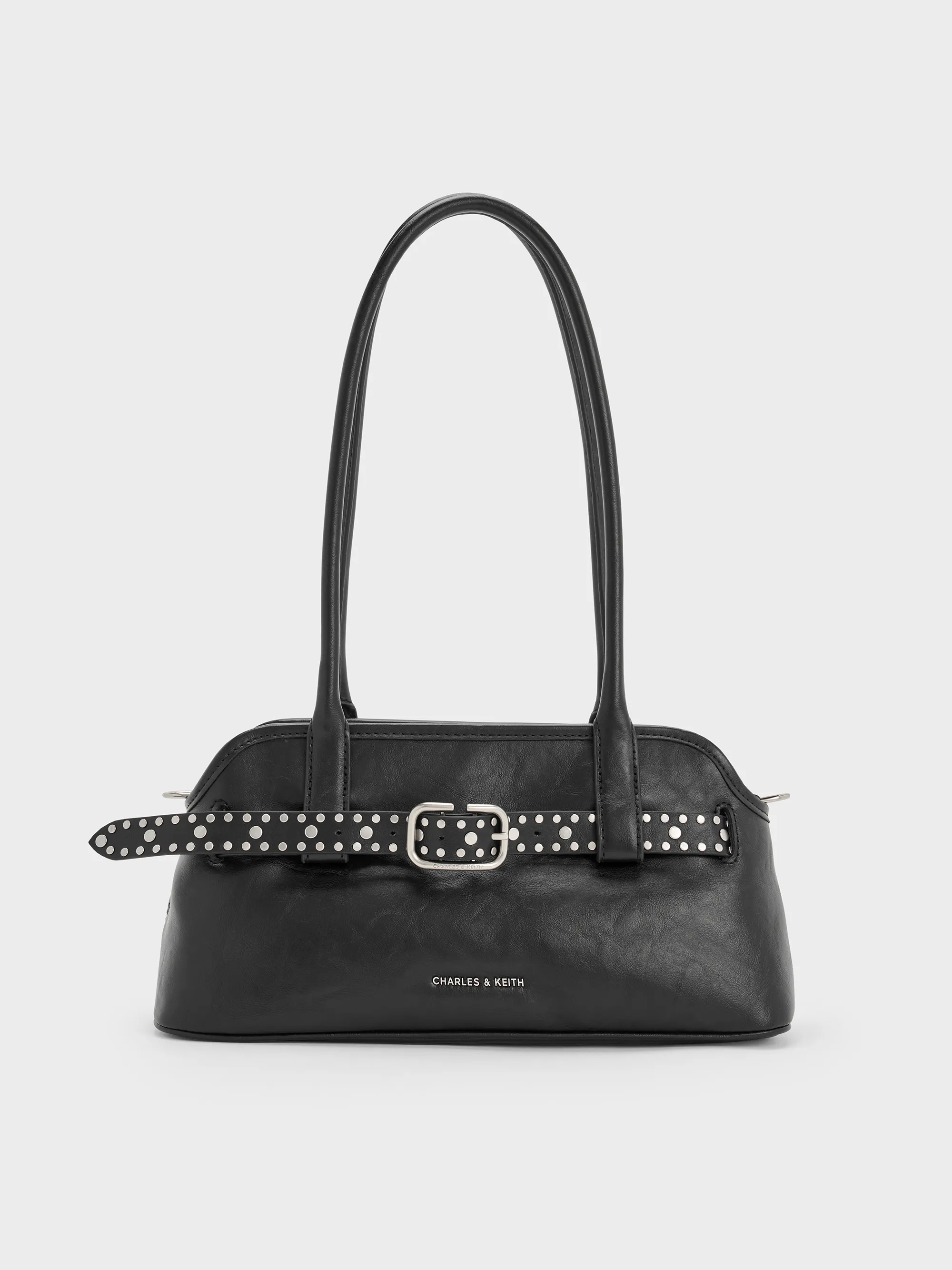 Charles & Keith - Victoria Studded Belted Elongated Shoulder Bag sold by Charles & Keith