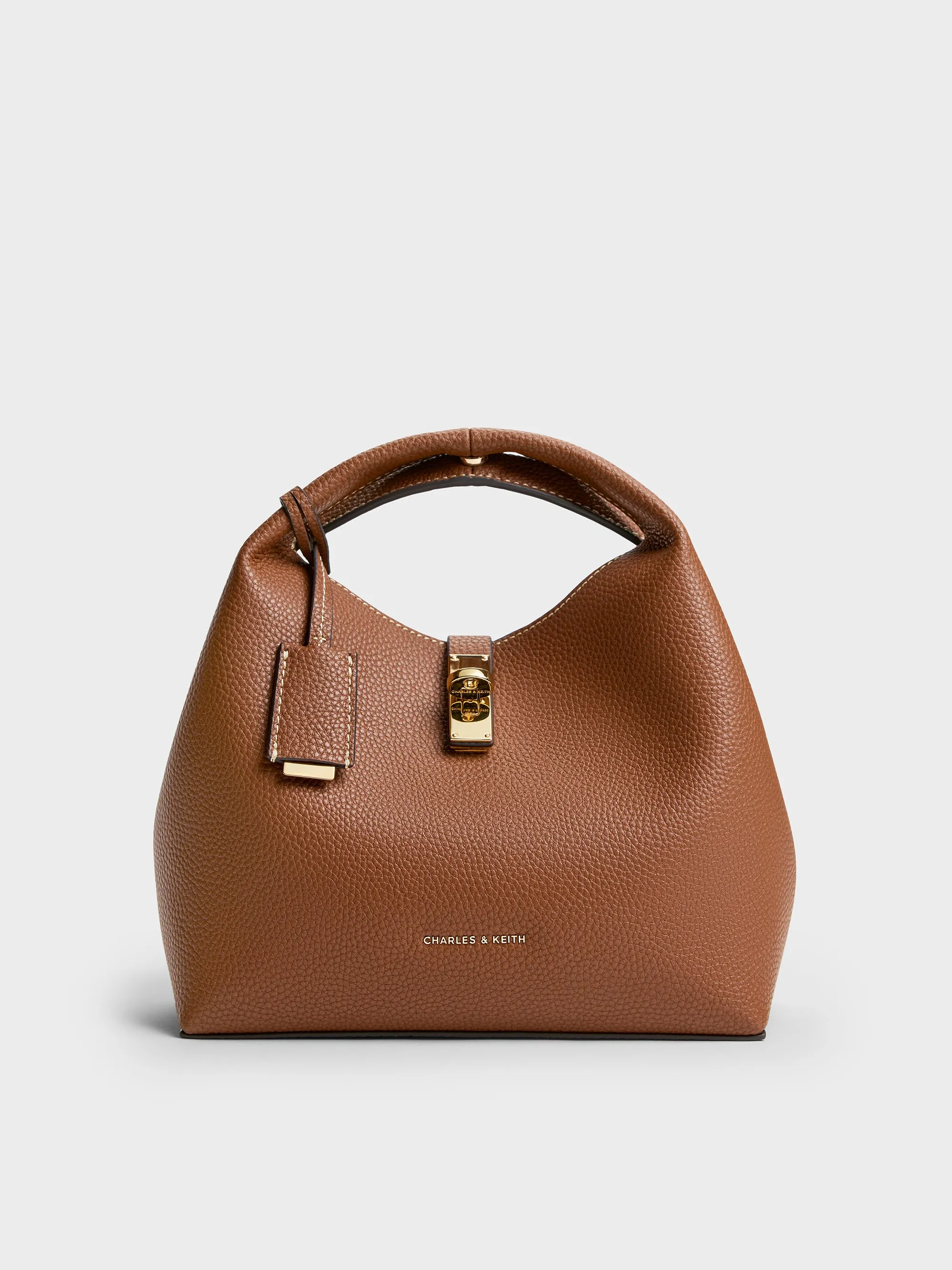 Charles & Keith - Chance Recycled Leather Turn-Lock Bucket Bag sold by Charles & Keith