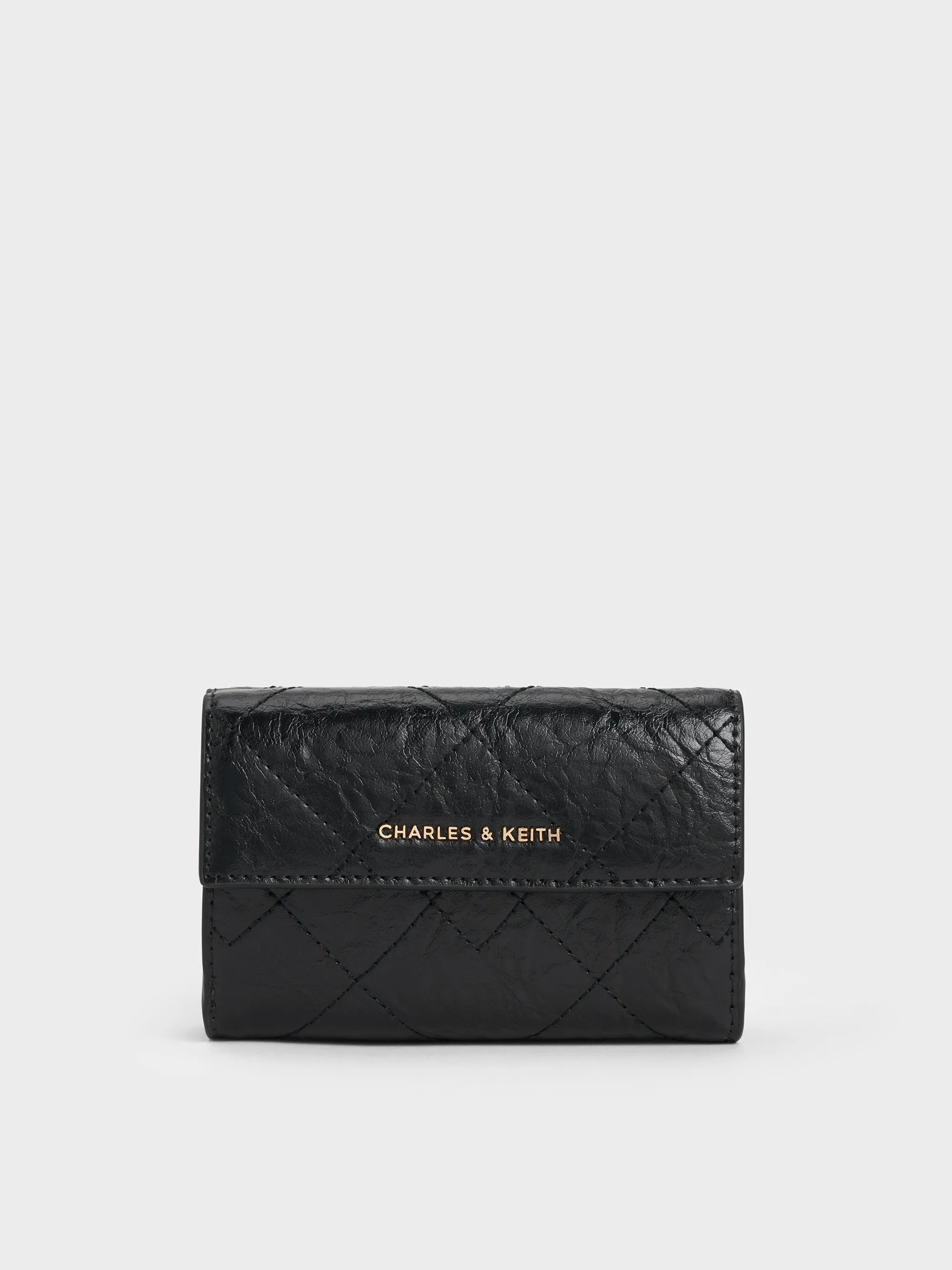 Charles & Keith - Duo Quilted Fold-Over Wallet sold by Charles & Keith