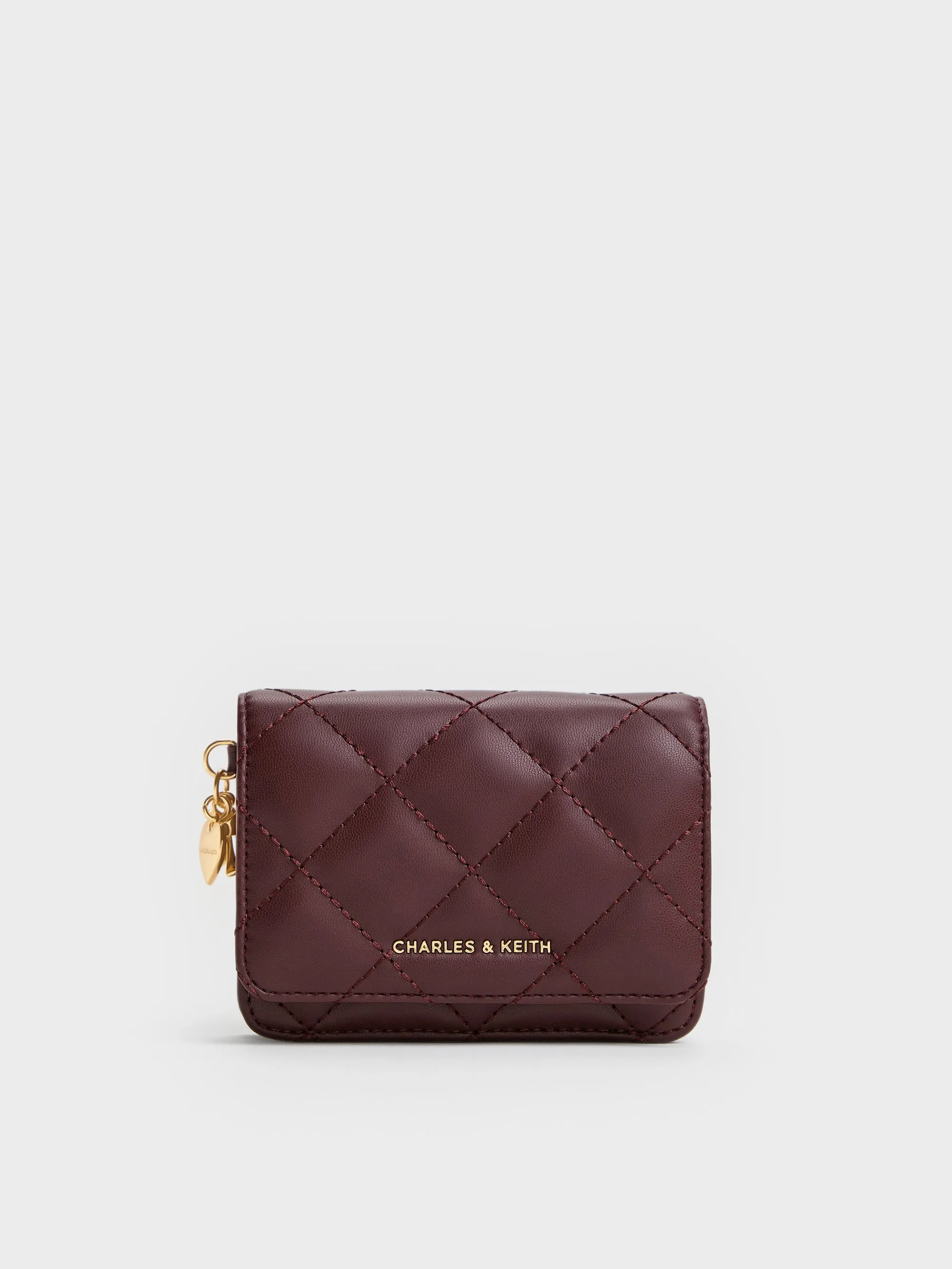 Charles & Keith - Arrietty Quilted Bow-Heart Charm Small Wallet sold by Charles & Keith