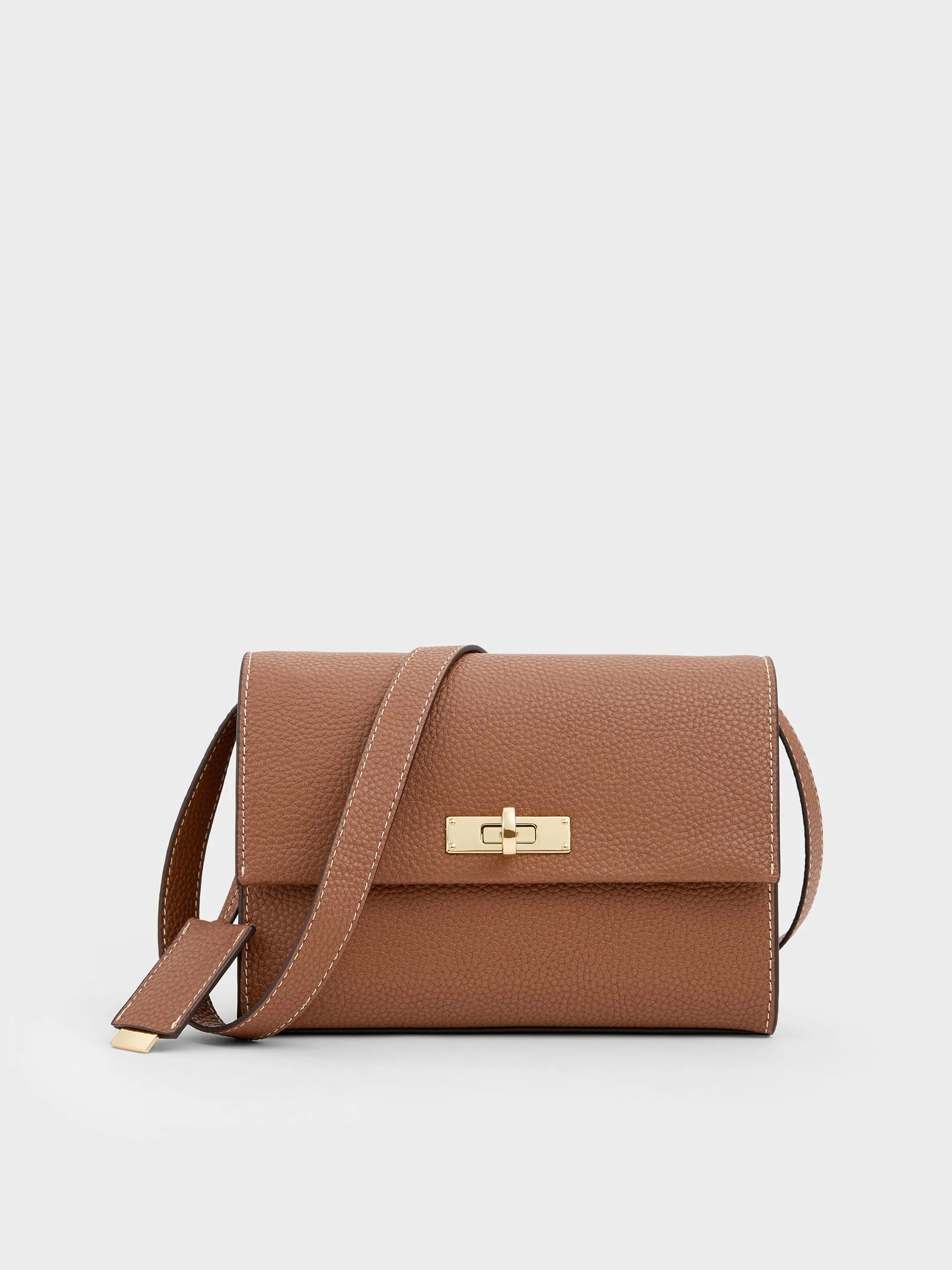 Charles & Keith - Chance Turn-Lock Crossbody Bag sold by Charles & Keith