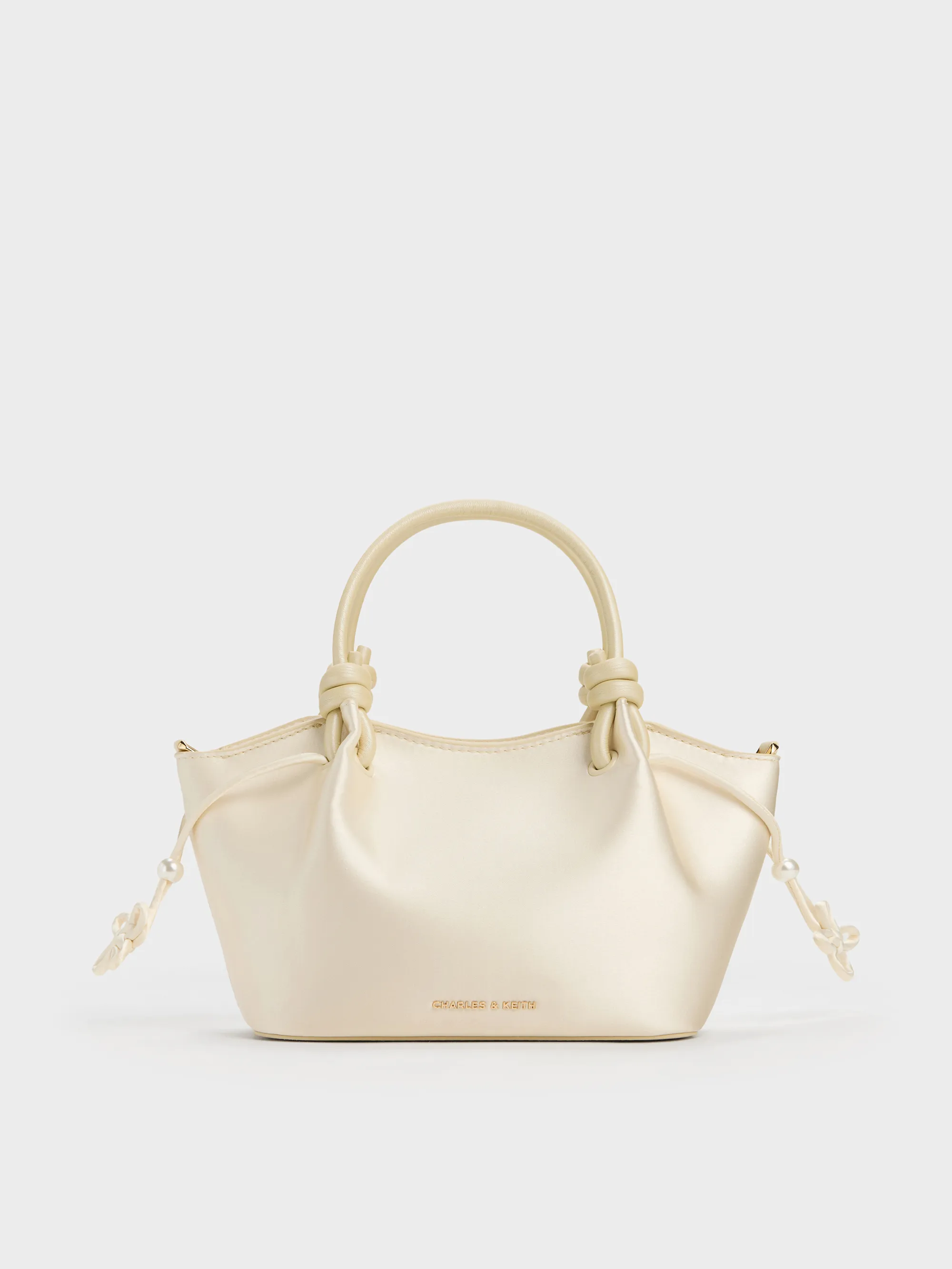 Charles & Keith - Sammie Pearl-Butterfly Knotted-Handle Wavy Tote Bag sold by Charles & Keith