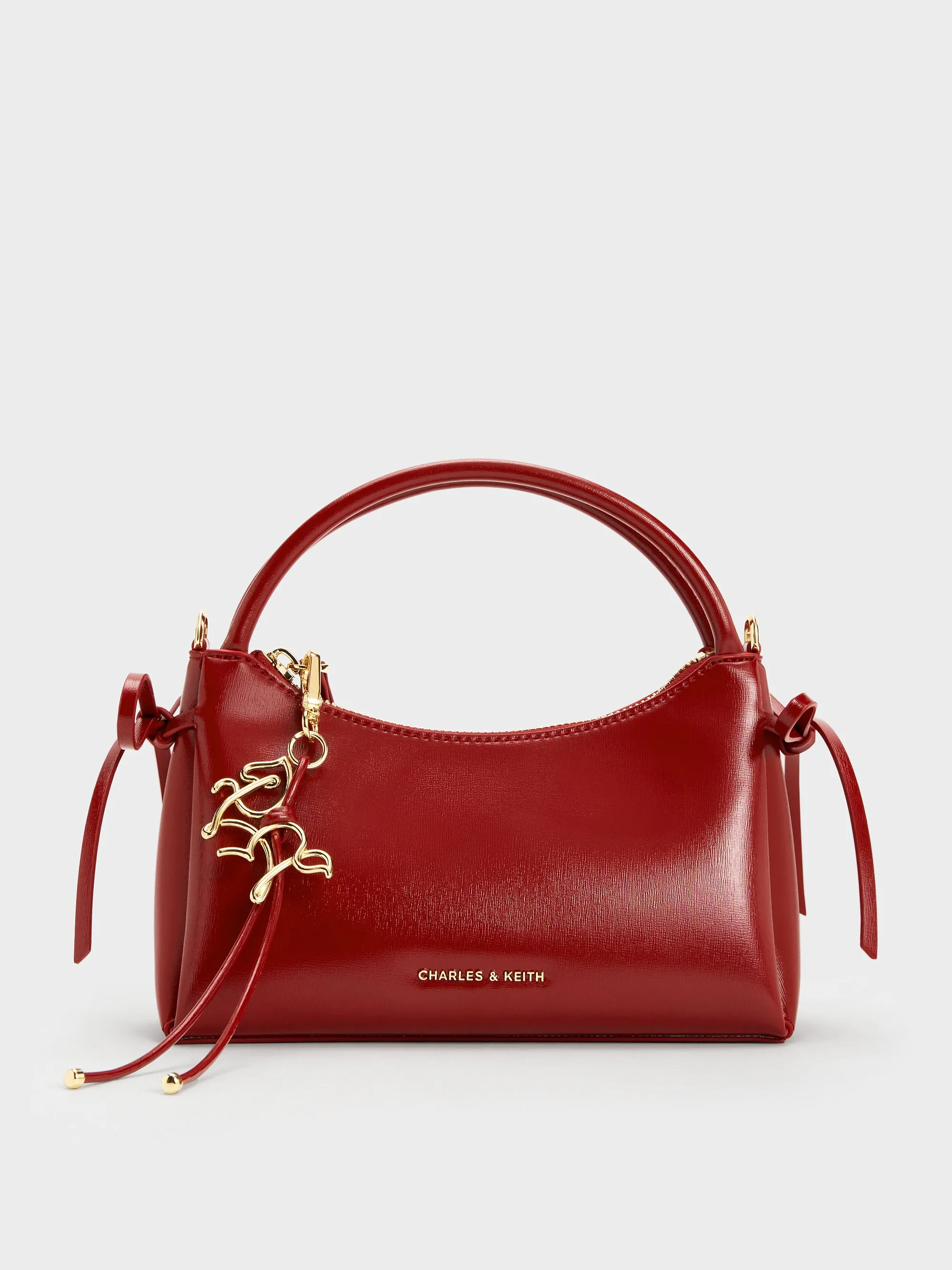 Charles & Keith - Hazel Bow Horse-Motif Top Handle Bag sold by Charles & Keith
