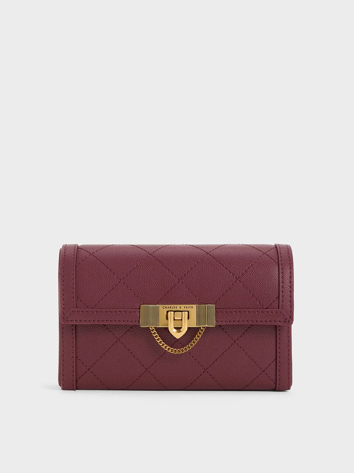 Charles & Keith - Tallulah Quilted Push-Lock Clutch sold by Charles & Keith