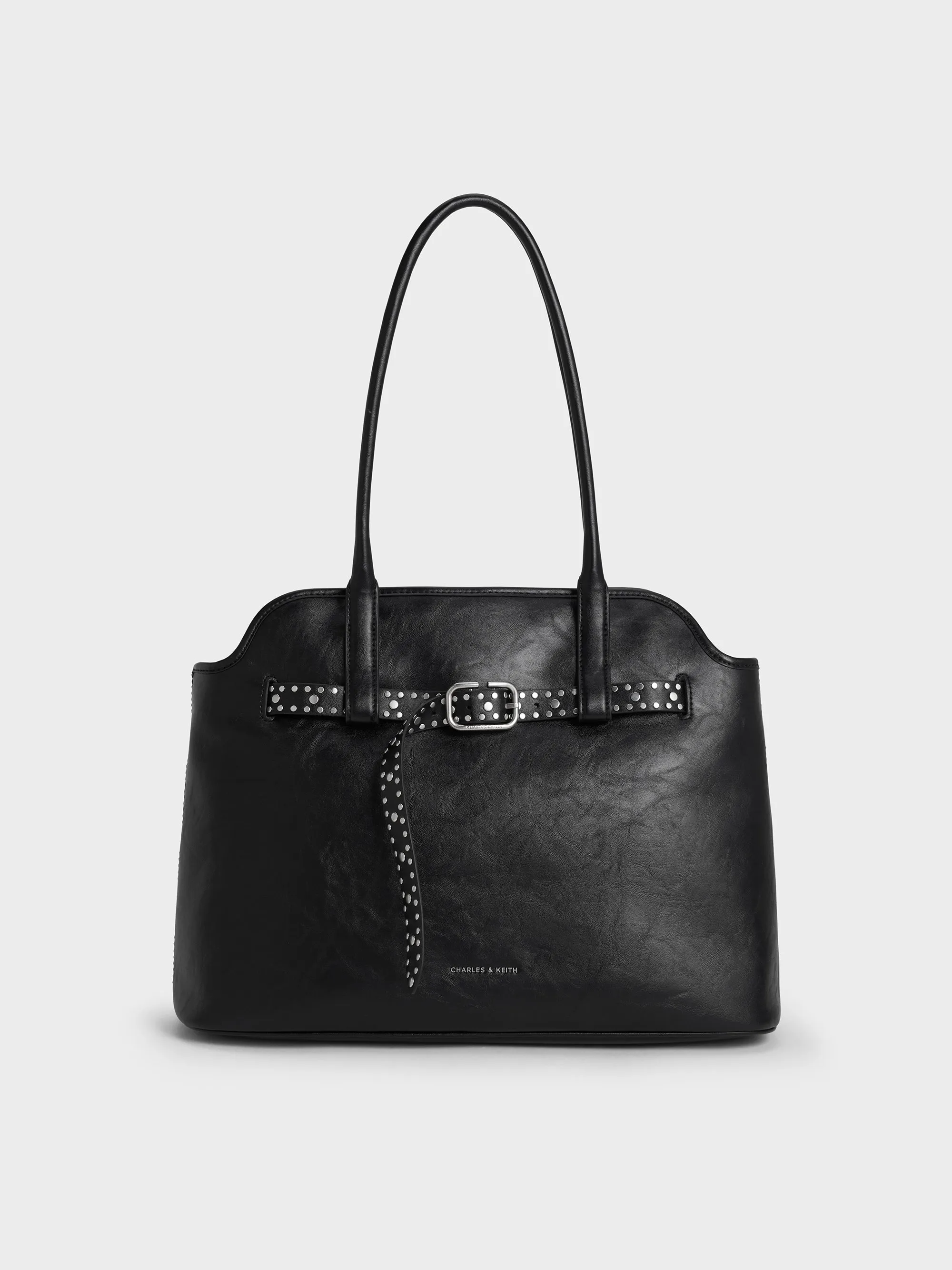 Charles & Keith - Victoria Studded Belted Trapeze Tote Bag sold by Charles & Keith