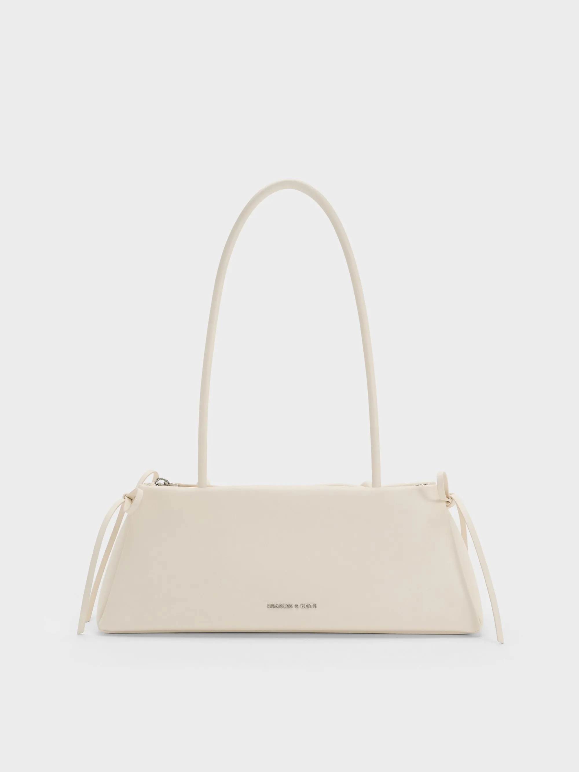 Charles & Keith - Hazel Bow Elongated Shoulder Bag sold by Charles & Keith