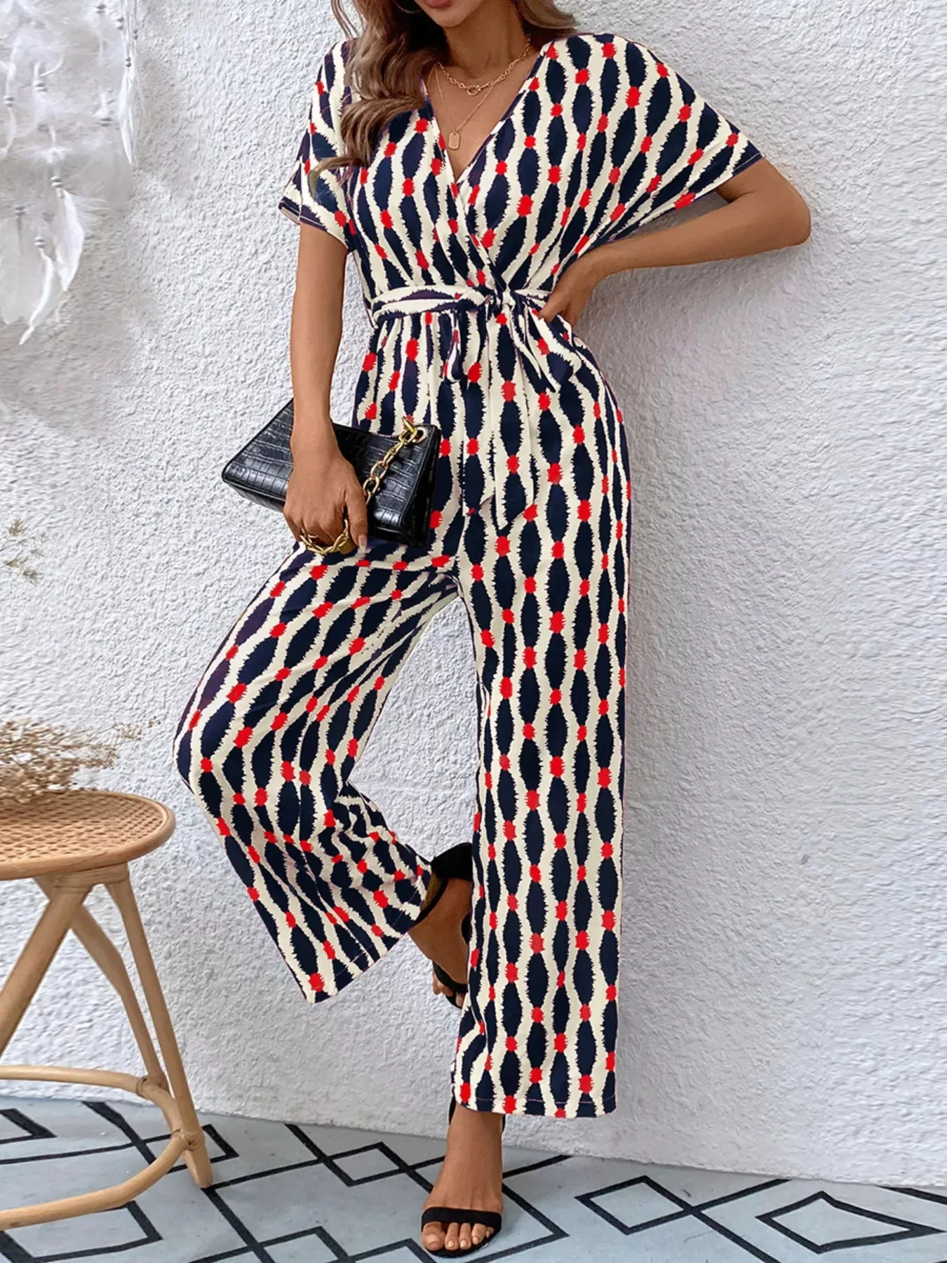 Printed Surplice Tie Waist Short Sleeve Jumpsuit sold by Unique Kulture product image thumbnail 3