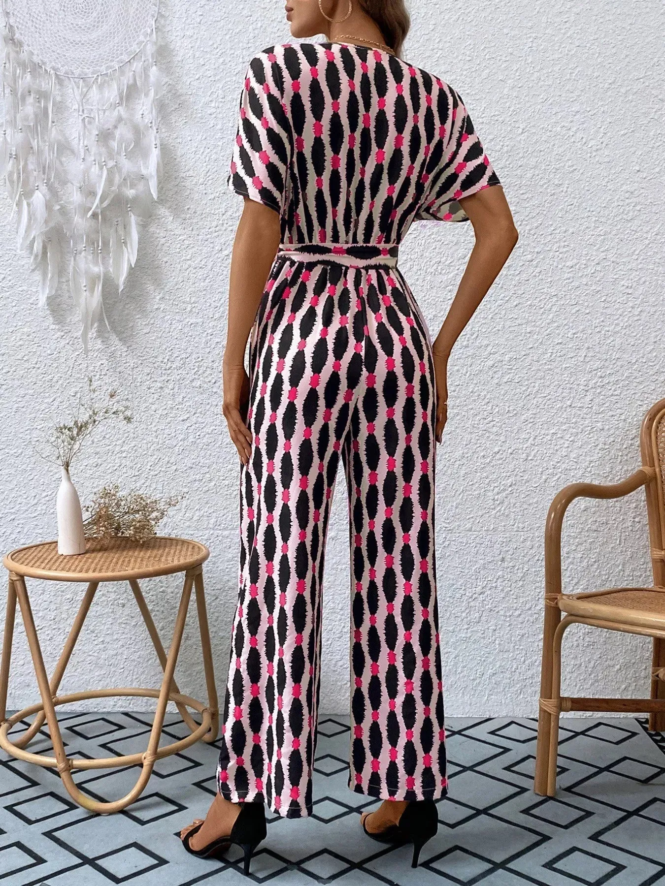Printed Surplice Tie Waist Short Sleeve Jumpsuit sold by Unique Kulture product image thumbnail 5