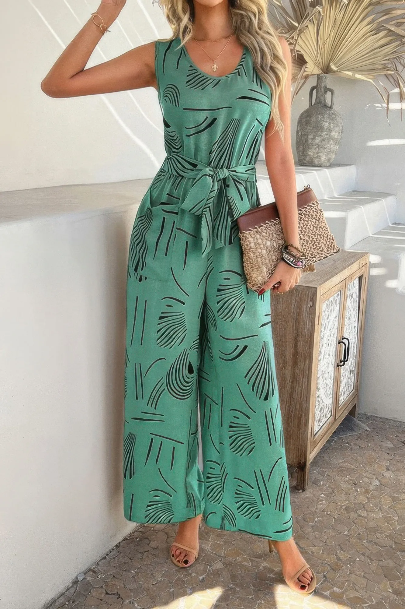 Allover Print Sleeveless Wide Leg Tie Waist Jumpsuit sold by Unique Kulture