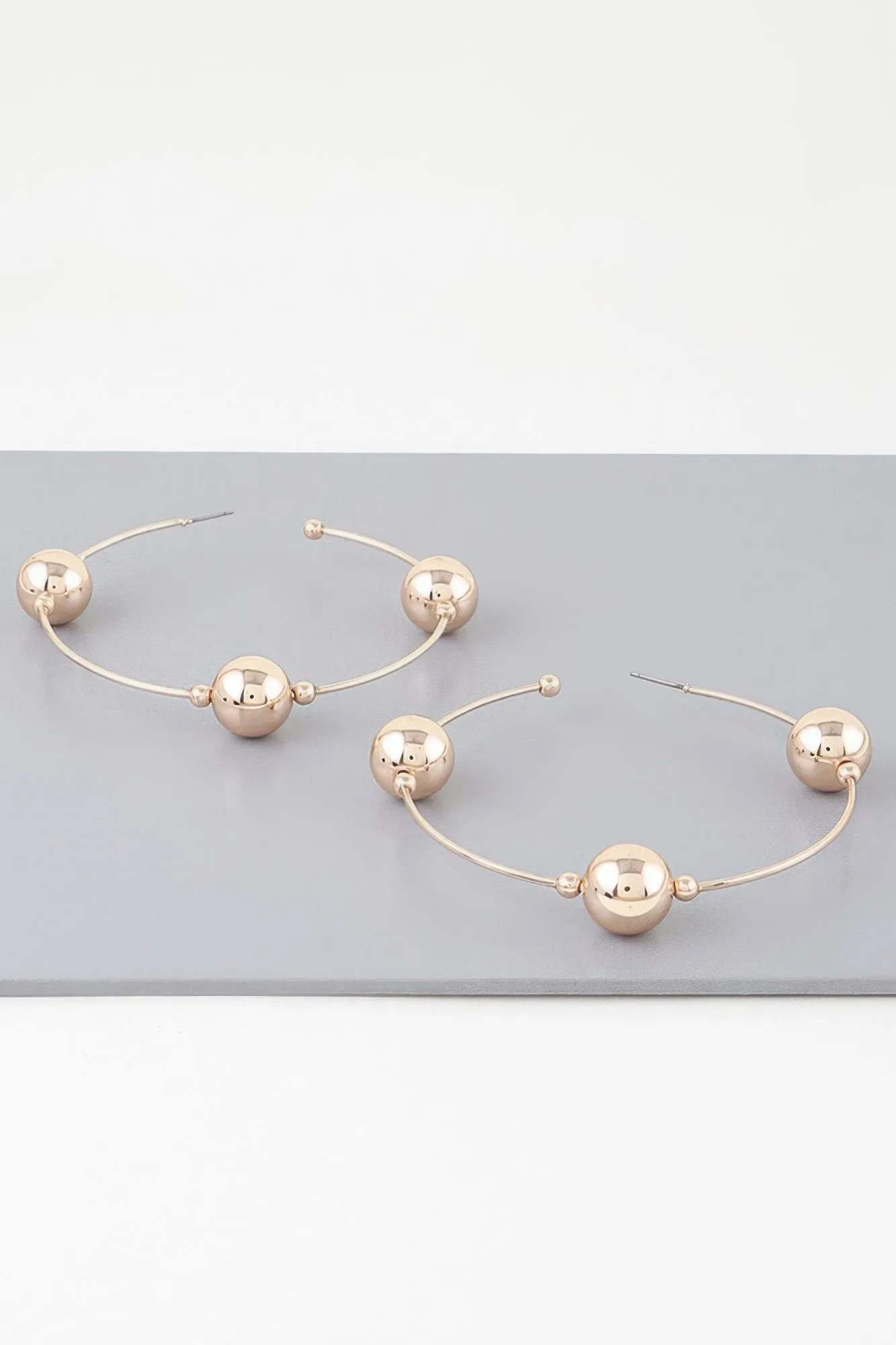 Triple Shiny Bead Hoop Earrings sold by Unique Kulture