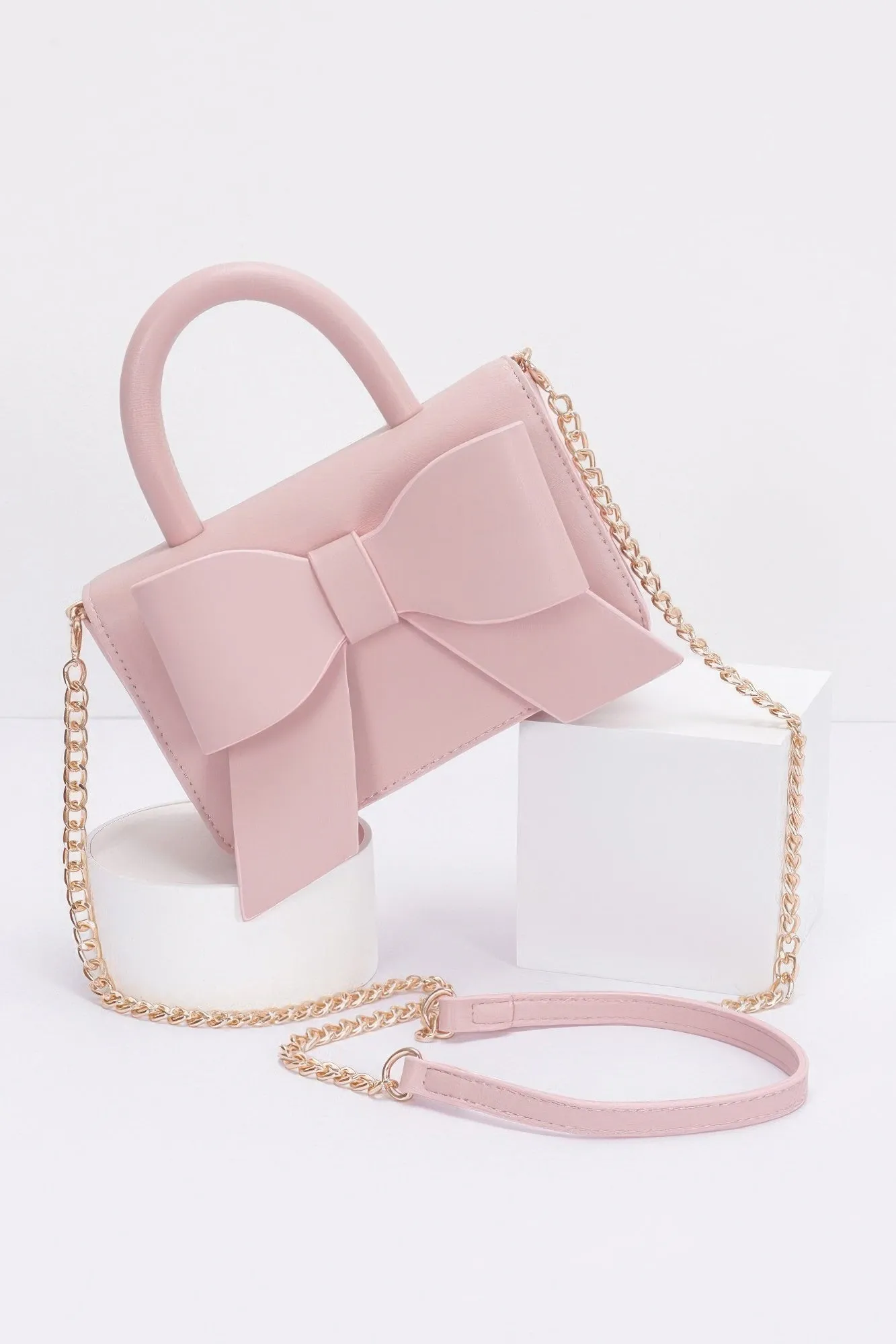 Faux Leather Ribbon Top Handle Bag sold by Unique Kulture