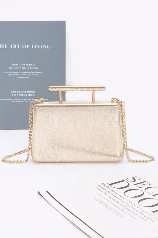 Metal Handle Top Case Clutch sold by Unique Kulture