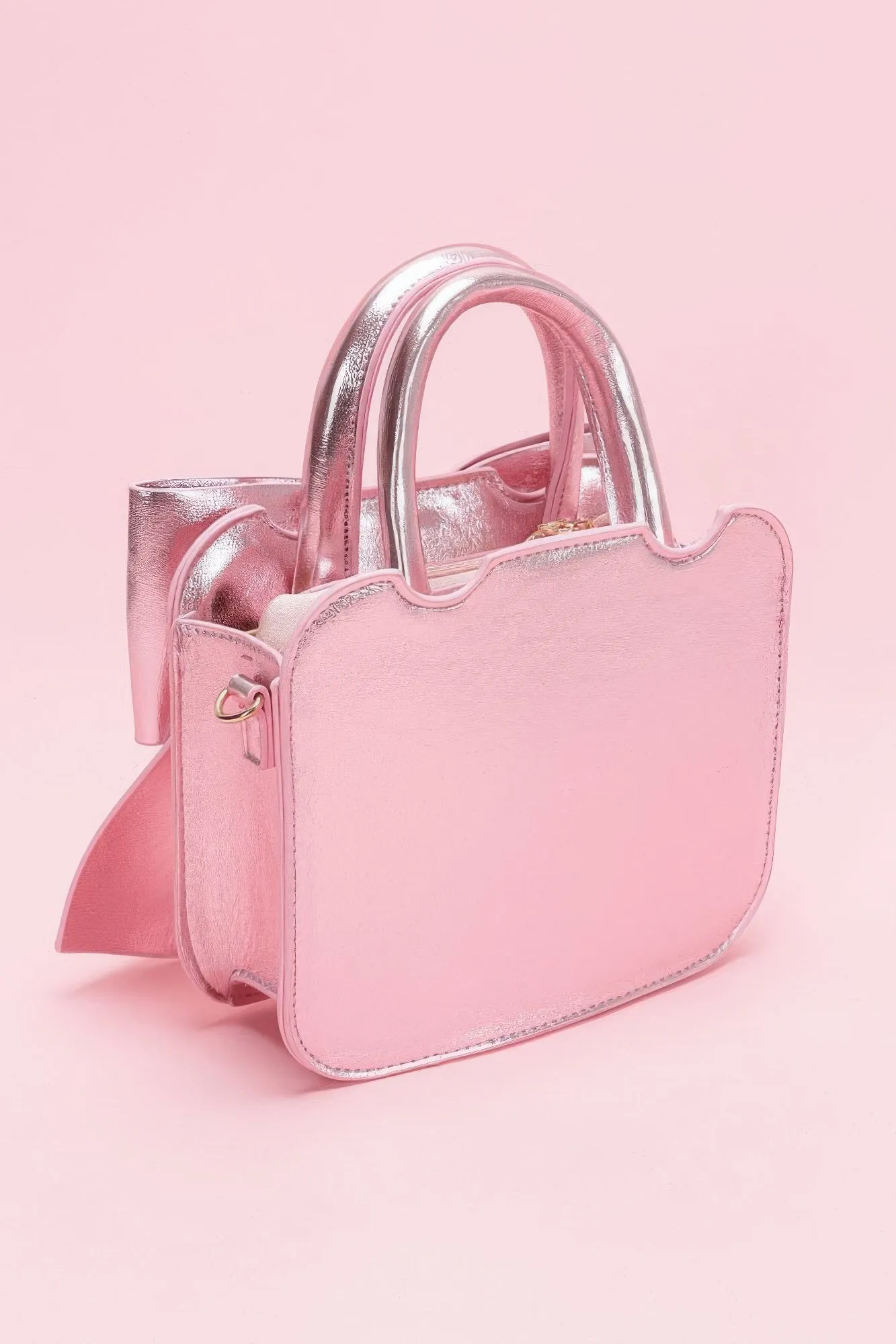 Metallic Bow Front Top Handle Clutch sold by Unique Kulture product image thumbnail 4