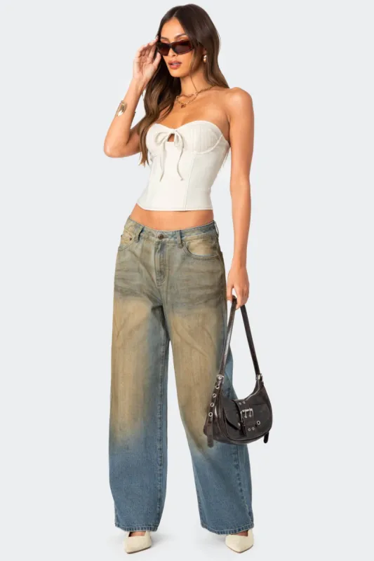 Muddy Washed Low Rise Jeans sold by Edikted