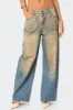 Muddy Washed Low Rise Jeans sold by Edikted