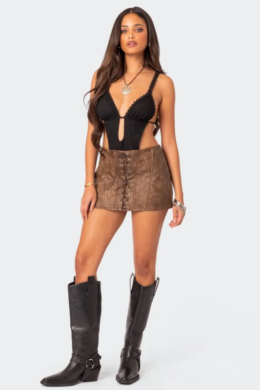 Ainsley Lace Up Faux Leather Mini Skirt sold by Edikted