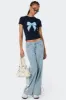 Washed Low Rise Ribbon Jeans sold by Edikted