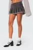 Nalani Washed Denim Pleated Mini Skort sold by Edikted