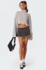 Nalani Washed Denim Pleated Mini Skort sold by Edikted