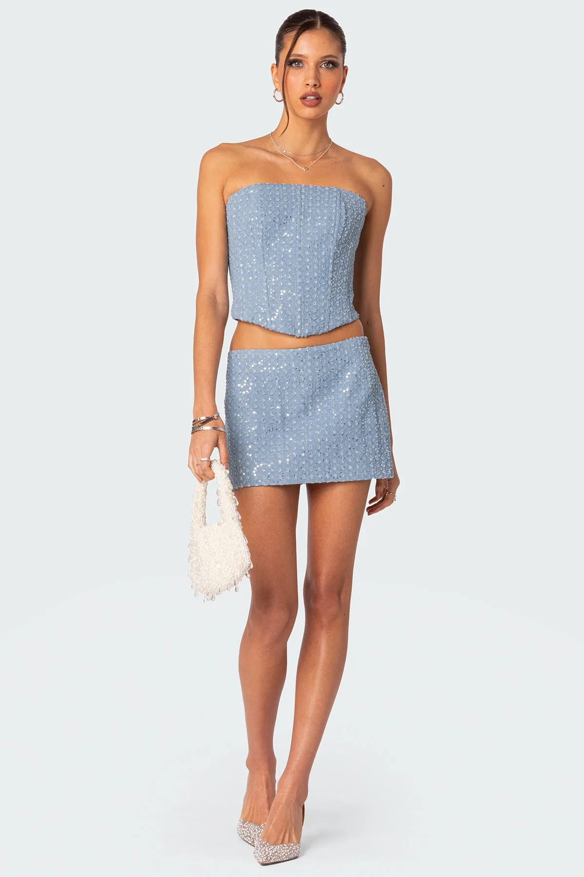 Icing sequined denim mini skirt sold by Edikted