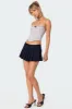 Pleated Denim Mini Skort sold by Edikted