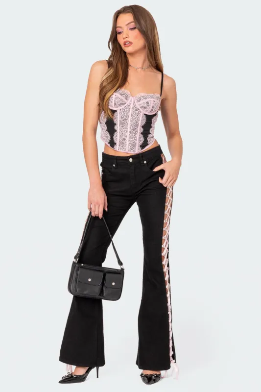 Laced Up Ribbon Mid Rise Flared Jeans sold by Edikted