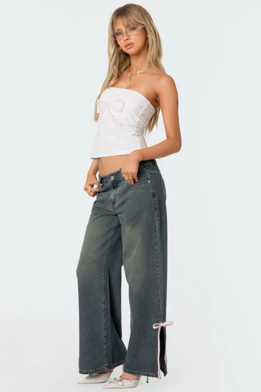 Bow Slitted Vintage Washed Jeans sold by Edikted