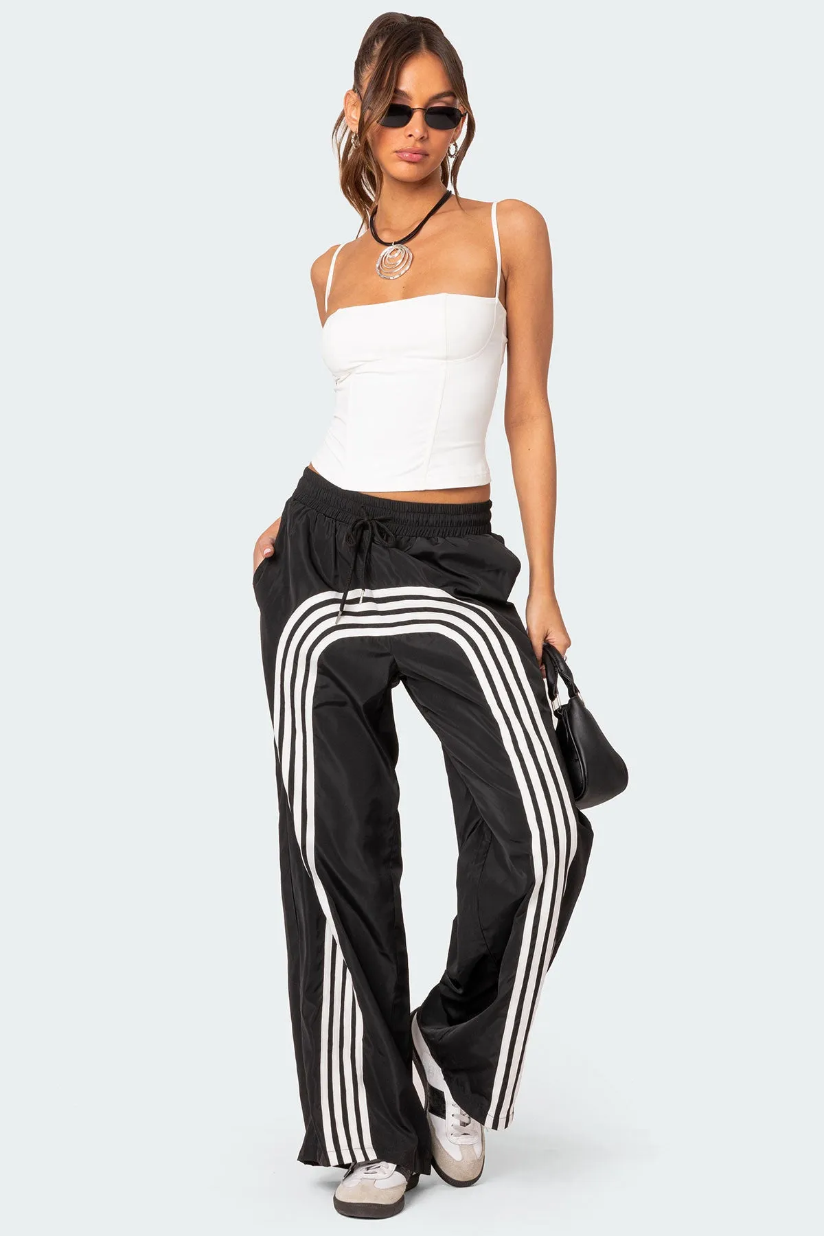 Wilda Striped Nylon Track Pants sold by Edikted