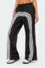 Wilda Striped Nylon Track Pants sold by Edikted