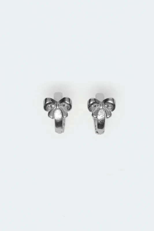Bow Huggy Hoop Earrings sold by Edikted
