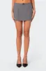 Take A Bow Mini Skirt sold by Edikted