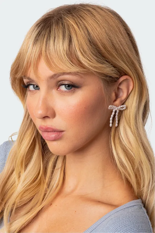 Pearl Bow Stud Earrings sold by Edikted