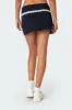 Heiress Eyelet Mini Skirt sold by Edikted