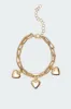 Triple Heart Charm Bracelet sold by Edikted
