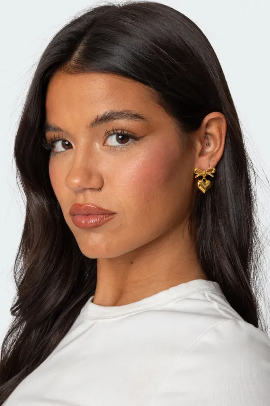 Bow Heart Charm Earrings sold by Edikted