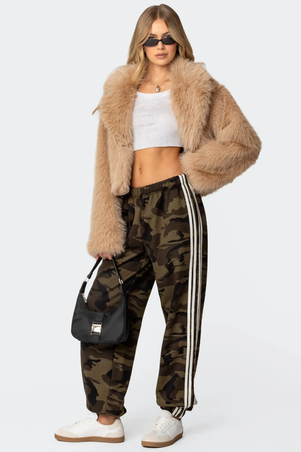 Camo Contrast Striped Sweatpants sold by Edikted