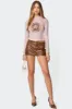 Studded Faux Leather Mini Skort sold by Edikted
