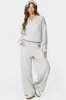 Ashtin Ruffle Trim Sweatpants sold by Edikted