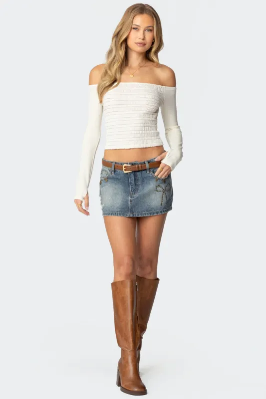 Studded Bow Distressed Denim Mini Skirt sold by Edikted