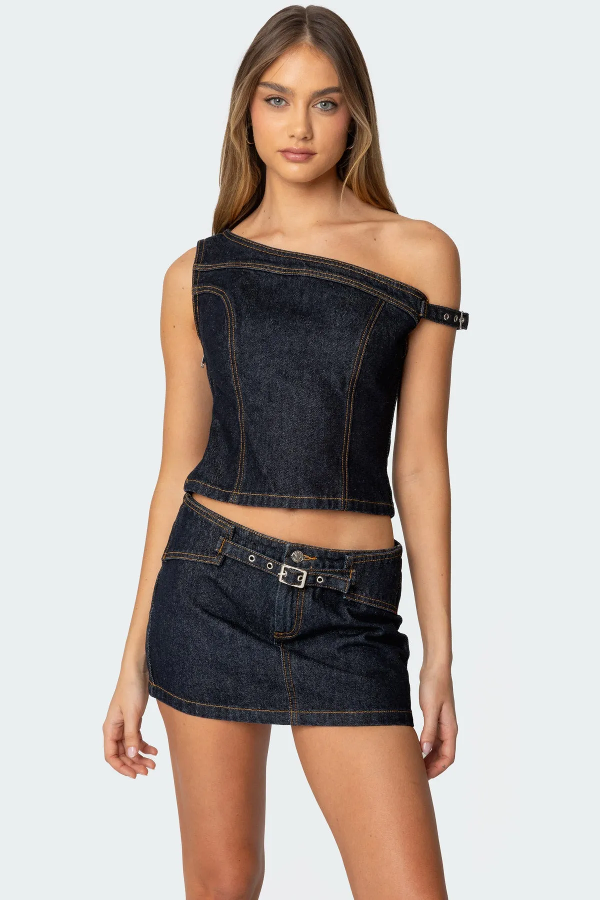 Keira Buckled Asymmetric Denim Top sold by Edikted