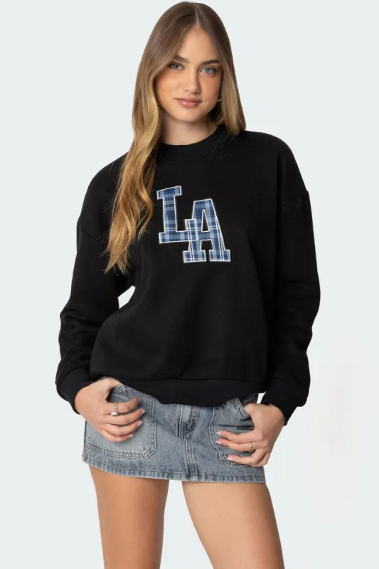La Plaid Sweatshirt sold by Edikted