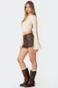 Pax Faux Leather Mini Skirt sold by Edikted